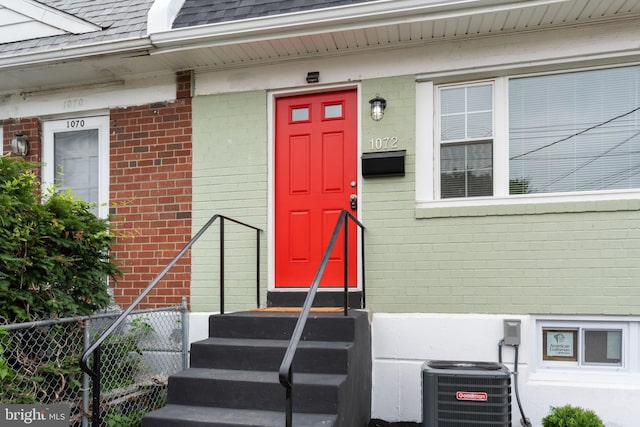 1072 Lakeshore Dr, Camden, NJ 08104 - view of exterior entry with brick siding and roof with shingles