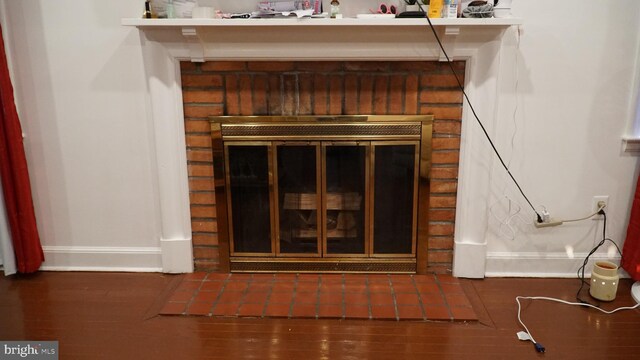812 Byram St, Reading, PA 19606 - detailed view of a brick fireplace and wood finished floors