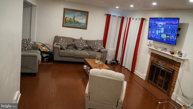 812 Byram St, Reading, PA 19606 - living room with recessed lighting, wood finished floors, and a fireplace