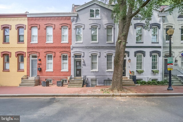 1513 Swann St NW, Washington, DC 20009 - townhome / multi-family property featuring brick siding and entry steps
