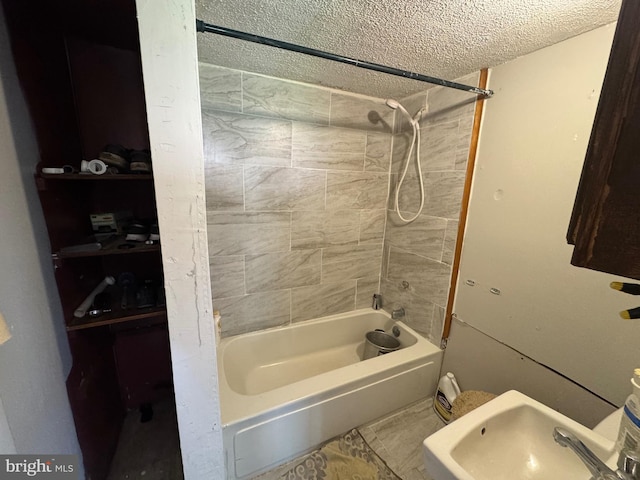 226 E Snyder Ave, Lansford, PA 18232 - bathroom with tub / shower combination and a textured ceiling