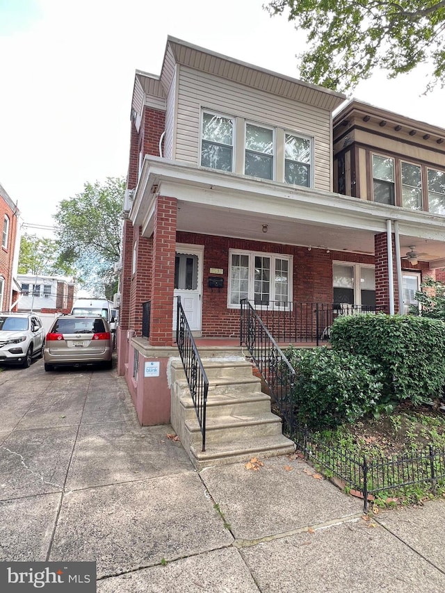 7033 Gillespie St, Philadelphia, PA 19135 - multi unit property with brick siding and covered porch
