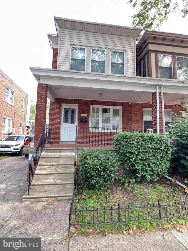 7033 Gillespie St, Philadelphia, PA 19135 - view of front of property with a porch and brick siding