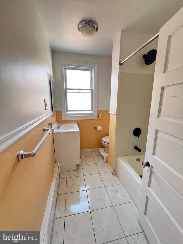 7033 Gillespie St, Philadelphia, PA 19135 - bathroom featuring marble finish flooring, a baseboard radiator, vanity, and bathing tub / shower combination