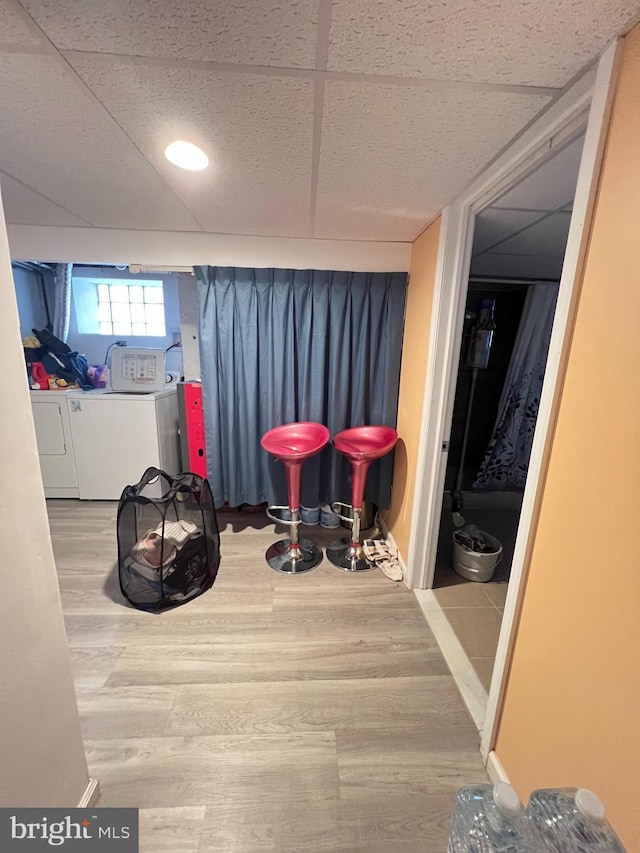 7033 Gillespie St, Philadelphia, PA 19135 - playroom featuring independent washer and dryer, wood finished floors, and a paneled ceiling