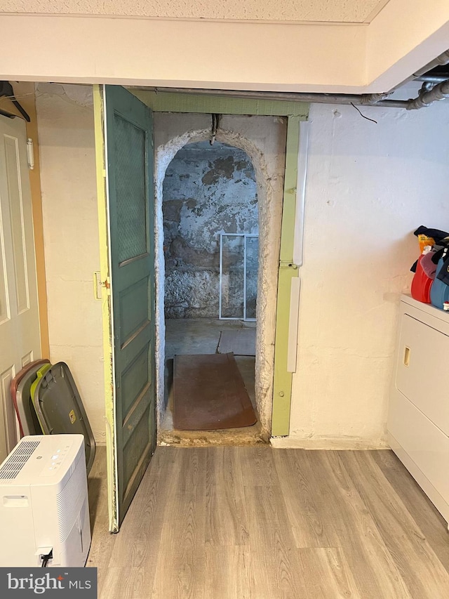 7033 Gillespie St, Philadelphia, PA 19135 - basement with light wood-style floors and washer / dryer