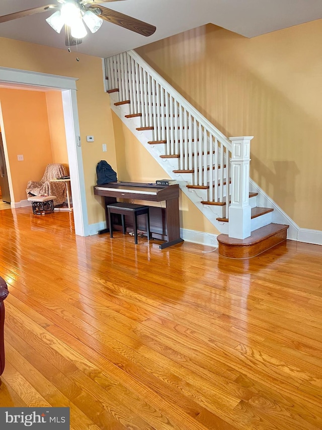 7033 Gillespie St, Philadelphia, PA 19135 - staircase with hardwood / wood-style flooring and ceiling fan