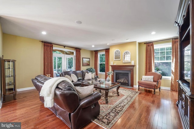 1901 Eamons Way, Annapolis, MD 21401 - living area featuring a glass covered fireplace, hardwood / wood-style floors, plenty of natural light, and recessed lighting