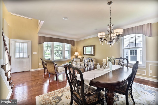 1901 Eamons Way, Annapolis, MD 21401 - dining area featuring crown molding, a chandelier, stairs, and dark wood-style flooring