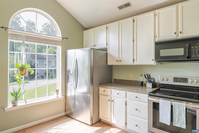 1470 Willow Lake Dr, Charlottesville, VA 22902 - kitchen with stainless steel appliances, lofted ceiling, plenty of natural light, white cabinets, and light wood-type flooring