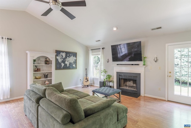 1470 Willow Lake Dr, Charlottesville, VA 22902 - living area with light wood-style floors, ceiling fan, a fireplace with flush hearth, and lofted ceiling
