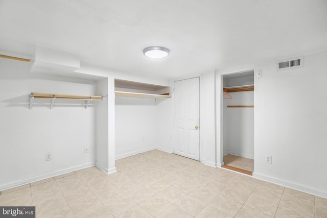 407 Pratt St, Fredericksburg, VA 22405 - unfurnished bedroom with two closets and baseboards