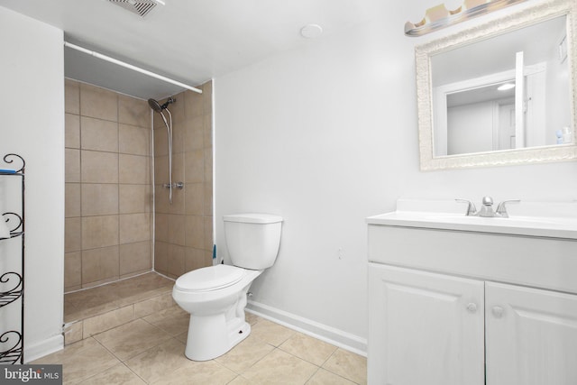 407 Pratt St, Fredericksburg, VA 22405 - bathroom with tile patterned flooring, vanity, and a tile shower