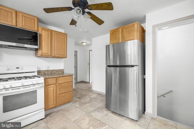 407 Pratt St, Fredericksburg, VA 22405 - kitchen with appliances with stainless steel finishes, ceiling fan, and light stone counters