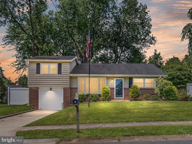 4 Paisley Dr, Wilmington, DE 19808 - tri-level home with brick siding, a garage, and concrete driveway