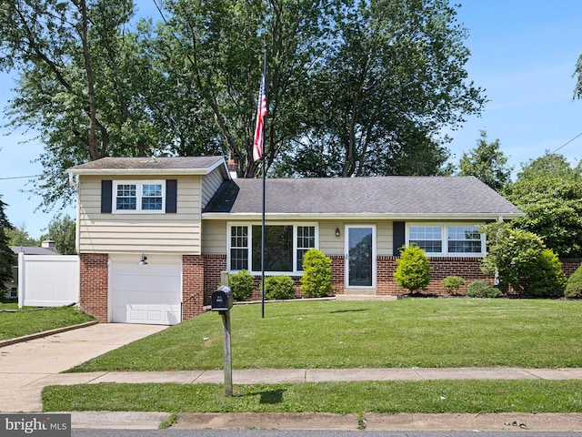 4 Paisley Dr, Wilmington, DE 19808 - tri-level home featuring driveway, a garage, and brick siding