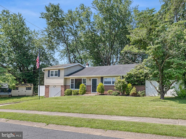 4 Paisley Dr, Wilmington, DE 19808 - tri-level home featuring brick siding, an attached garage, a front yard, a storage unit, and a chimney