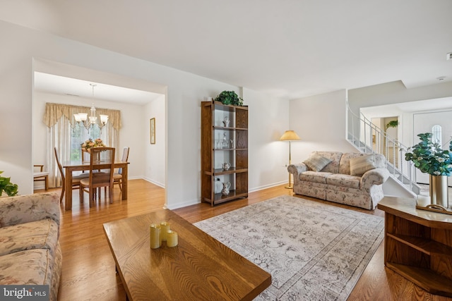 81 Argyle Ave, Blackwood, NJ 08012 - living area with stairs, a chandelier, and wood finished floors