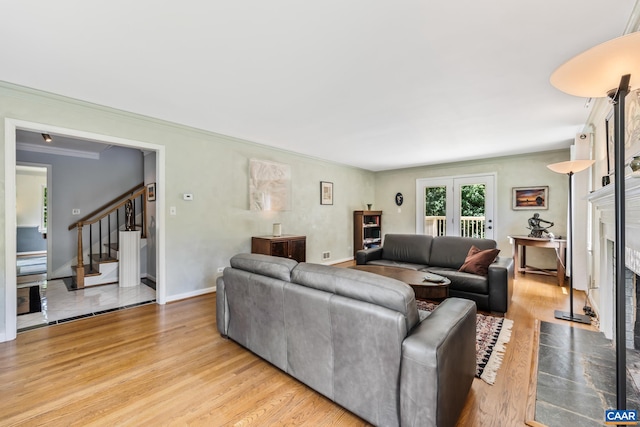 2402 Bennington Rd, Charlottesville, VA 22901 - living area featuring a fireplace, ornamental molding, wood finished floors, and stairs
