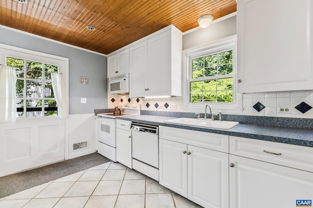 2402 Bennington Rd, Charlottesville, VA 22901 - kitchen with white appliances, wood ceiling, crown molding, dark countertops, and healthy amount of natural light
