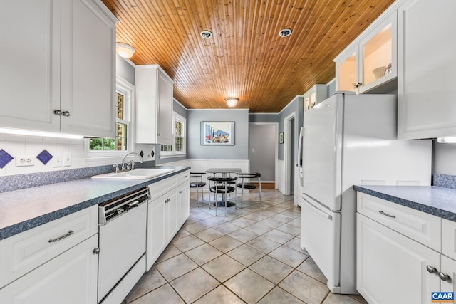 2402 Bennington Rd, Charlottesville, VA 22901 - kitchen featuring white appliances, wood ceiling, white cabinetry, light tile patterned floors, and dark countertops
