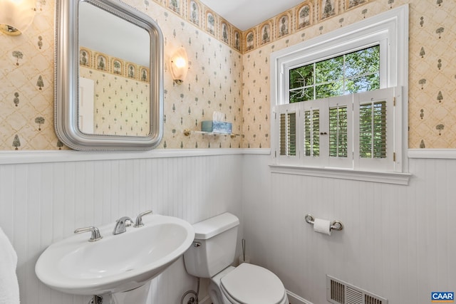 2402 Bennington Rd, Charlottesville, VA 22901 - half bath featuring wallpapered walls and wainscoting