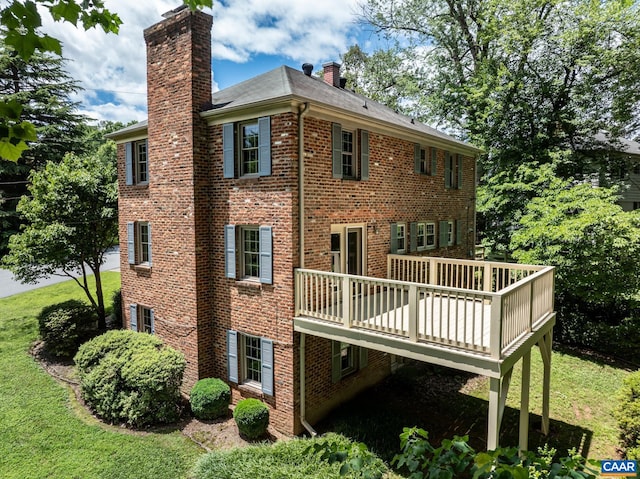 2402 Bennington Rd, Charlottesville, VA 22901 - back of property with a chimney, brick siding, a lawn, and a deck