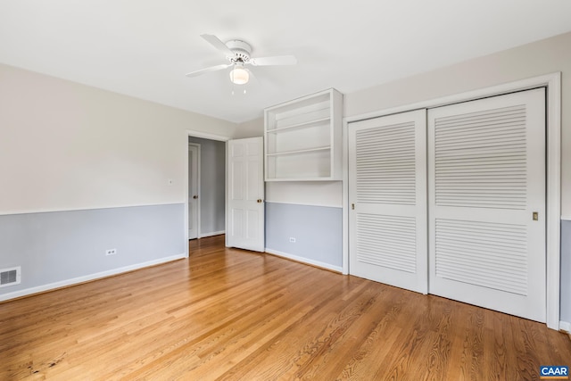 2402 Bennington Rd, Charlottesville, VA 22901 - unfurnished bedroom featuring a closet, light wood-style floors, and a ceiling fan
