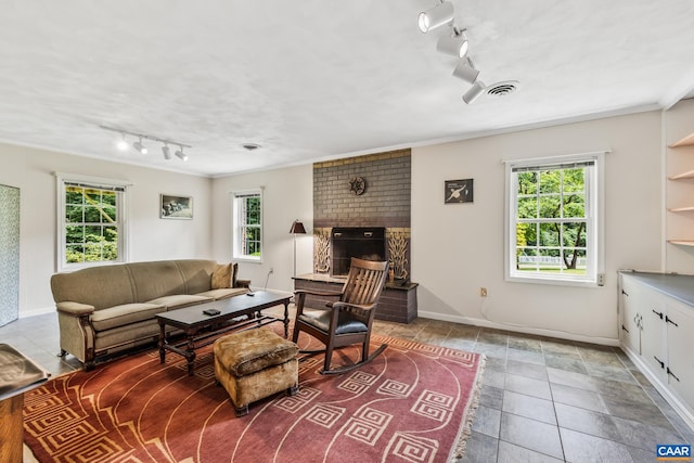 2402 Bennington Rd, Charlottesville, VA 22901 - living area with track lighting, plenty of natural light, a fireplace, and tile patterned floors