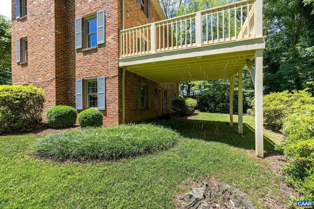 2402 Bennington Rd, Charlottesville, VA 22901 - view of home's exterior with brick siding, a yard, and a deck