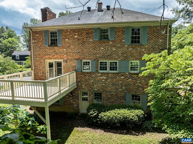 2402 Bennington Rd, Charlottesville, VA 22901 - back of property featuring a chimney, a deck, and brick siding