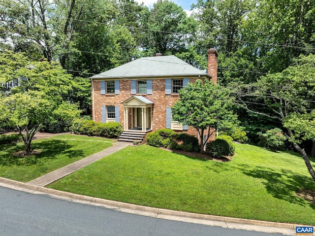 2402 Bennington Rd, Charlottesville, VA 22901 - view of front of home featuring a chimney, a front lawn, and brick siding