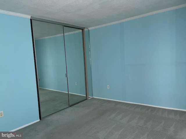 1420 Locust St Unit 20Q, Philadelphia, PA 19102 - unfurnished bedroom with carpet floors, crown molding, a closet, and a textured ceiling