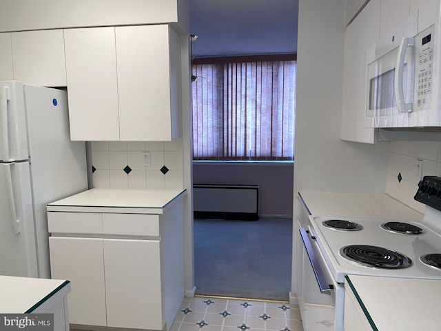 1420 Locust St Unit 20Q, Philadelphia, PA 19102 - kitchen featuring white appliances, light countertops, and white cabinets