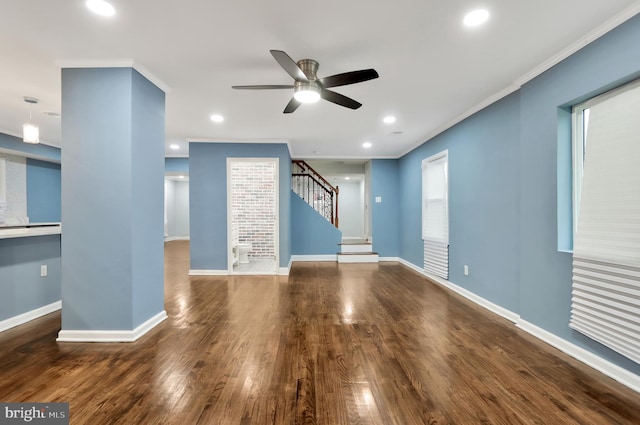 1133 46th St SE, Washington, DC 20019 - unfurnished living room featuring ceiling fan, stairs, wood finished floors, crown molding, and recessed lighting