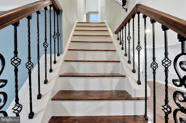 1133 46th St SE, Washington, DC 20019 - stairway featuring wood finished floors and baseboards