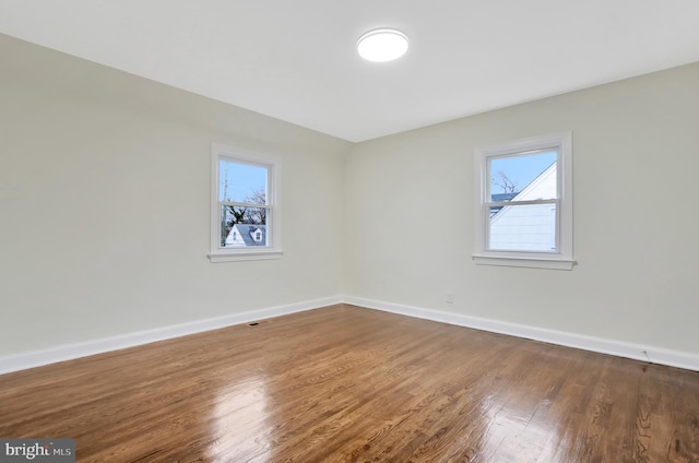 1133 46th St SE, Washington, DC 20019 - empty room featuring healthy amount of natural light and wood finished floors