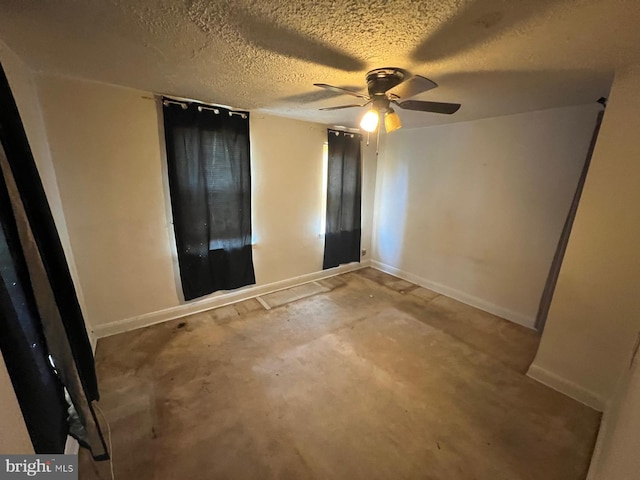 2817 Bookert Dr, Baltimore, MD 21225 - unfurnished bedroom with unfinished concrete floors, a textured ceiling, and a ceiling fan