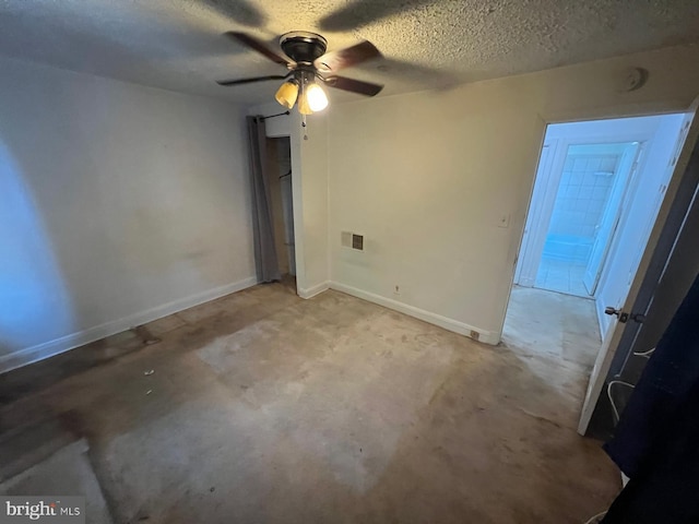 2817 Bookert Dr, Baltimore, MD 21225 - unfurnished room with ceiling fan, a textured ceiling, unfinished concrete floors, and a smoke detector
