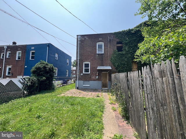 2817 Bookert Dr, Baltimore, MD 21225 - rear view of house featuring brick siding