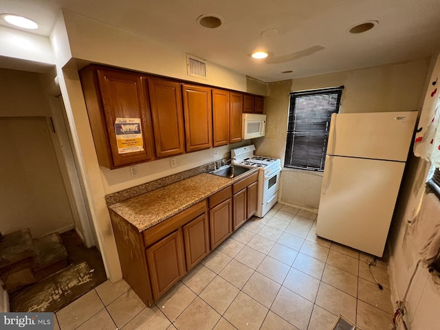 2817 Bookert Dr, Baltimore, MD 21225 - kitchen featuring white appliances, brown cabinets, light tile patterned flooring, and recessed lighting