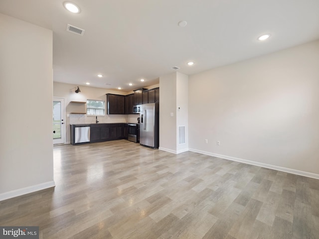 38 Preening Rd, Hedgesville, WV 25427 - unfurnished living room with light wood finished floors and recessed lighting
