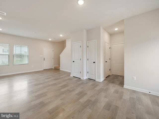 38 Preening Rd, Hedgesville, WV 25427 - unfurnished living room with recessed lighting and light wood-type flooring