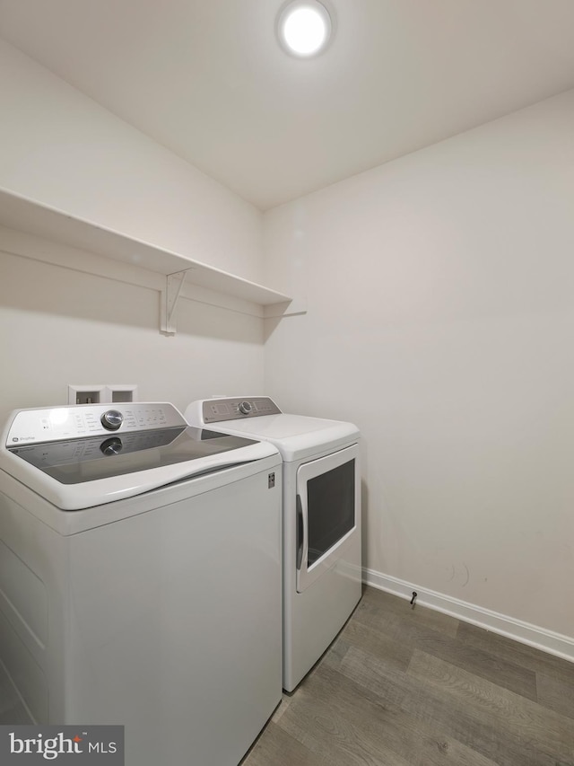 38 Preening Rd, Hedgesville, WV 25427 - laundry room featuring independent washer and dryer and wood finished floors