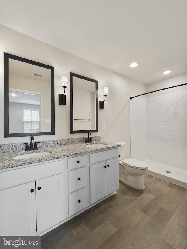 38 Preening Rd, Hedgesville, WV 25427 - full bath with double vanity, wood finished floors, a tile shower, and recessed lighting