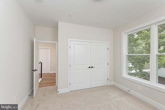 512 Marshall Ave, Pikesville, MD 21208 - unfurnished bedroom featuring light carpet and a closet