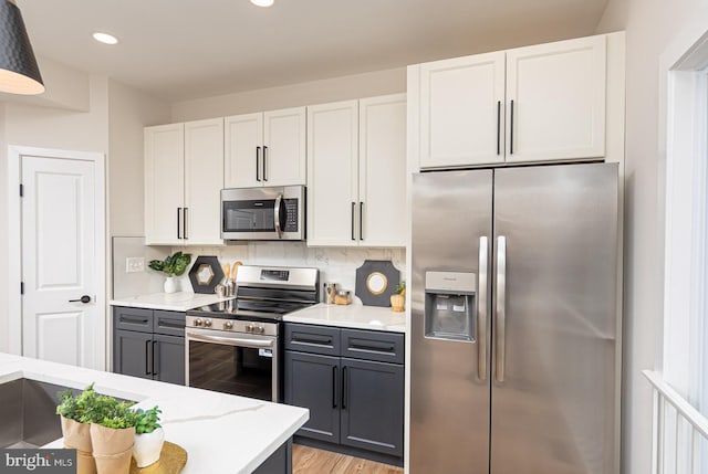 512 Marshall Ave, Pikesville, MD 21208 - kitchen featuring appliances with stainless steel finishes, white cabinetry, tasteful backsplash, gray cabinets, and recessed lighting