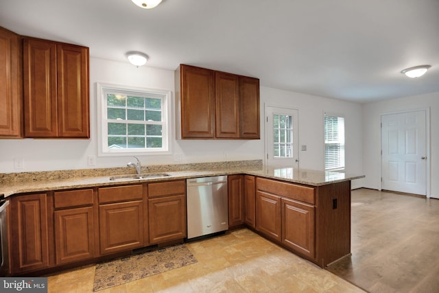40534 Miss Ettas Way, Leonardtown, MD 20650 - kitchen featuring dishwasher, brown cabinetry, a peninsula, and light stone counters