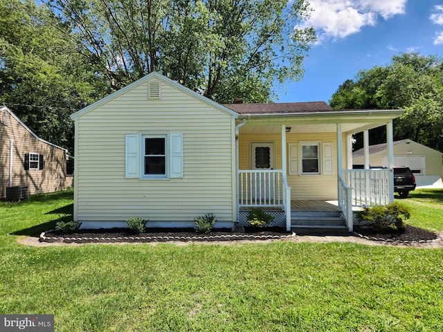 30483 Bennett Rd, Salisbury, MD 21804 - bungalow-style house with covered porch and a front lawn