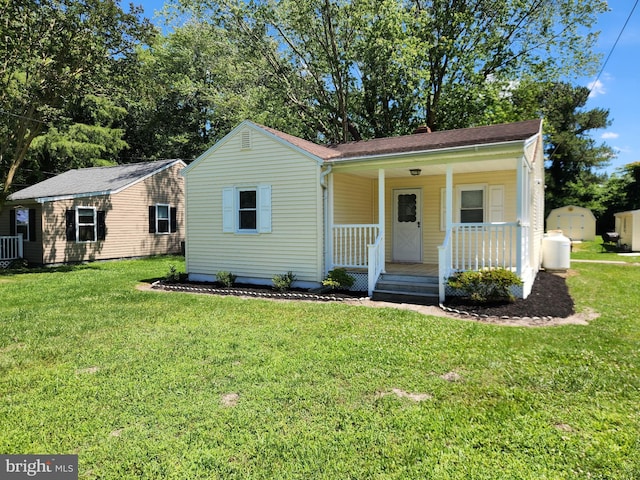 30483 Bennett Rd, Salisbury, MD 21804 - view of front facade with a porch and a front lawn